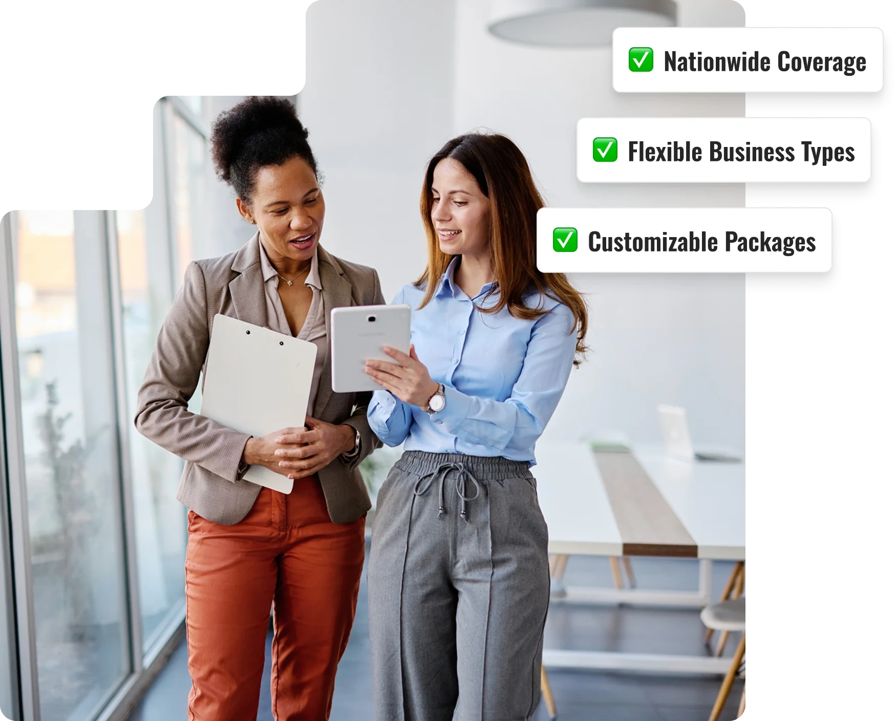 Two businesswomen looking at a tablet